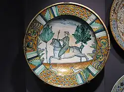 Here, the main decoration continues over the cavetto