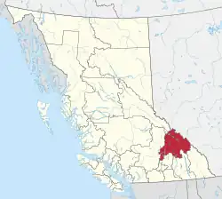 A map of British Columbia depicting its 29 regional districts and equivalent municipalities. One is highlighted in red.