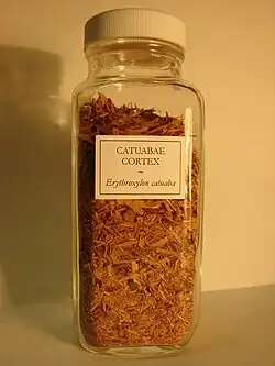 Photo of a bottle filled with brown bark, labelled "Catuabae Cortex"