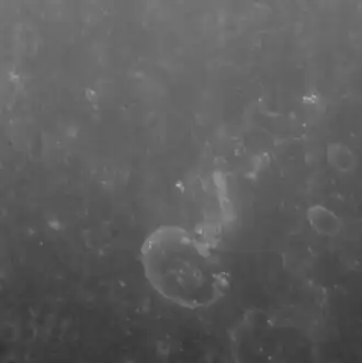 Chaikovskij crater interior, with a bright scarp and possible hollows