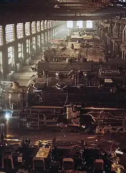 2514 and other locomotives at the workshop of the C&NW; 2514 is the third locomotive.