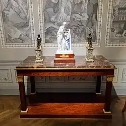 Empire console table; 1804–1814; mahogany, gilded bronze, chiseled gilded bronze and fossil gray marble; 91.5 x 154 x 73.5&nbsp;cm; Musée des Arts Décoratifs (Paris)[64]