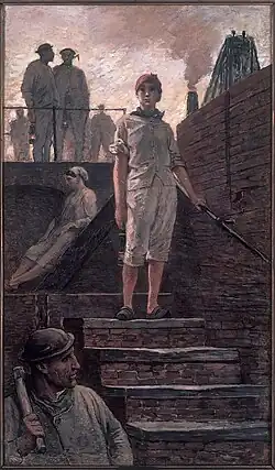 Female miner descending into the pit