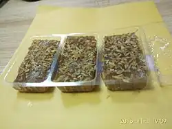 Three small cakes, sprinkled with coconut