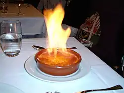 Preparation of crème brûlée, a rich custard base topped with a contrasting layer of hard caramel