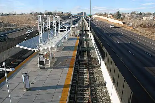 picture of a bus station near the highway