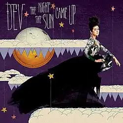 In a fantasy, almost cartoony illustration of a night sky with stars, Dev stands atop a cloud as she looks at the camera. The moon is seen fading into the sun, referencing the title of the album. The words "Dev" and "The Night The Sun Came Up" are written over the image in a thin white font.