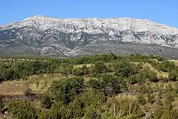 Picture of large mountain with about 30-degree sloped sides