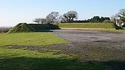 Airfield dispersal utilising a basic type of protected revetment consisting of raised earth banks, at the former RAF Harrowbeer.