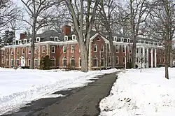 The college's admission office on the left wing of the building; Dole Residence Hall on the right wing