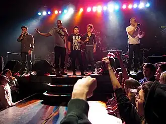 Doomtree performing at First Avenue in 2010 (left to right: Cecil Otter, P.O.S, Mike Mictlan, Dessa, and Sims)