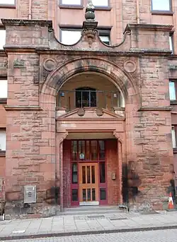A entrance to a brick church-like building.