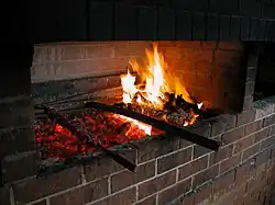 Grilling espetada at a Portuguese community day in Petersham
