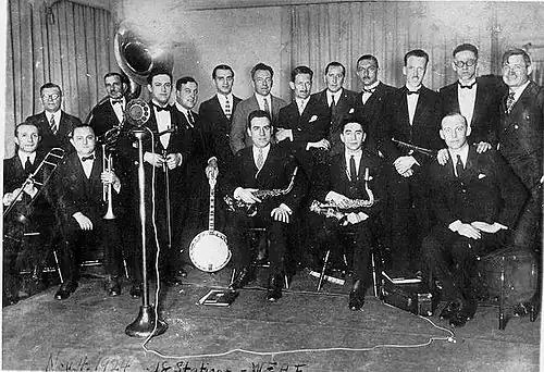 The Eveready Hours election night broadcast from WEAF to 18 stations on November 4, 1924: Will Rogers (far right), Art Gillham, Wendell Hall, Carson Robison, Eveready Quartet, Graham McNamee and the Waldorf-Astoria Dance Orchestra.