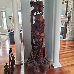 Life-size wooden carving of Shou in private home