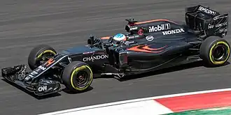 Fernando Alonso driving the McLaren MP4-31 at the 2016 Malaysian Grand Prix.
