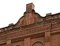 Detail of parapet and chimney on south side of Engine House.