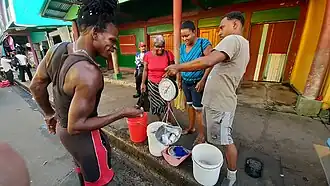 Fish sellers on Avenida del Comercio, December 2023