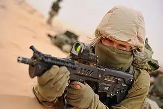 Female soldier of the Caracal Battalion during a field exercise, 2012