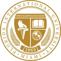 A gold and white seal. On the outer roundel are the words Florida International University and Miami, set in a serif. A shield topped with the motto "Spes Scientia Facultas" dominates the middle. Beneath are a torch, book, and globe. A scroll beneath the shield contains the year of foundation, 1968, and a laurel.