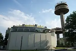 The former Theaterama (now the Queens Theatre) seen in 2018. The observation towers are visible on the right.