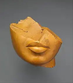 Fragment of a queen's face; 1353–1336&nbsp;BC; yellow jasper; height: 13&nbsp;cm, width: 12.5&nbsp;cm, depth: 12.5&nbsp;cm; Metropolitan Museum of Art