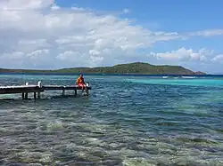 Boy on pier in Fraile