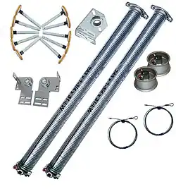 Torsion springs, drums, cables, end bearing plates, center bearing plate and rollers (wheels) all hardware needed for a functional garage door.