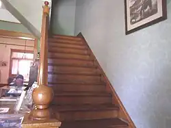 Staircase leading to the second floor of the Manistee Mansion.