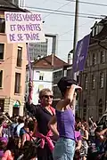 Demonstration in Biel/Bienne, with women holding up signs.