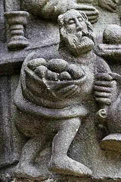 At the "Last Supper" a servant is busy serving bread rolls and wine.