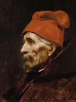 Old man wearing a red fez