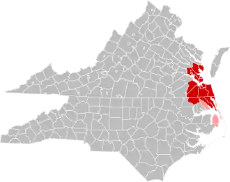Jurisdictions in the Hampton Roads MSA are colored in red. Jurisdictions in the CSA, but not the MSA, are colored in pink.