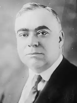 Black-and-white portrait of Harry Nice in a suit