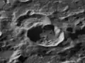 Oblique view of Hayn E crater (below center) and older Hayn J crater (above center)