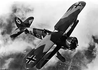 a biplane with Nazi German markings in flight