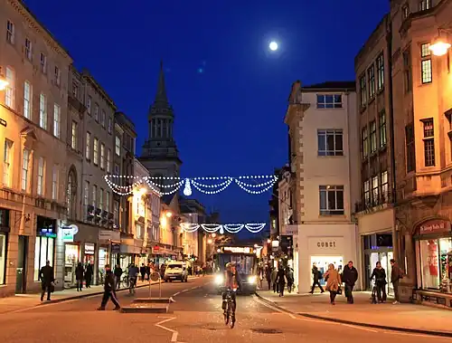 Night view of the High Street with Christmas lights, looking east from Carfax