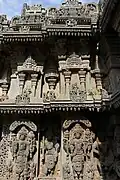 Hindu deities and aediculae in relief at Lakshmi Narasimha temple, Nuggehalli