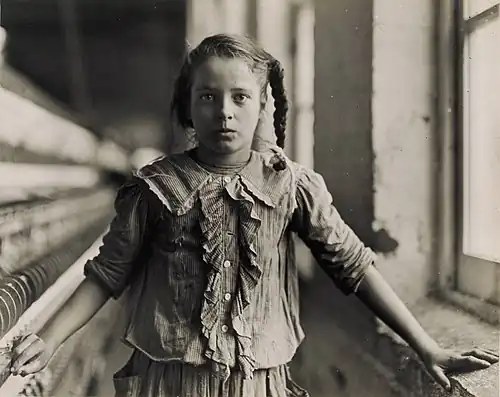 Lewis W. Hine, Adolescent Girl, a Spinner, in a Carolina Cotton Mill, 1908[56]