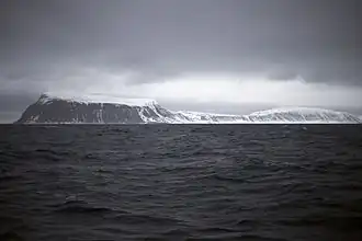 The southernmost point, Kapp Thor, and the highest point, Iversenfjellet (370&nbsp;m) seen from south