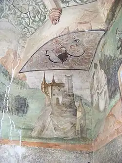 A mural of the castle part of a painting on the ceiling of a building.