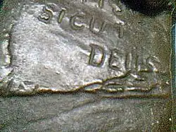 Detail showing rip to Bible page