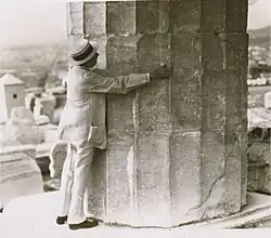Base of a Doric column, Parthenon, embraced by Frank G. Carpenter