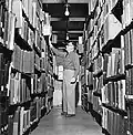 Student browsing the stacks in the Command and General Staff College Library located in Wagner Hall at Fort Leavenworth, KS - 1941