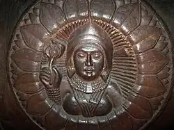 Female Figure holding a Lotus