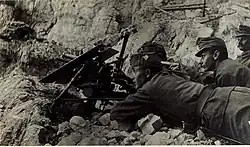 M15 with a gun shield and its trail folded backward on a mountain