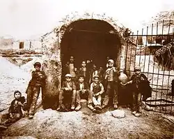 Carusi at the entrance of a sulfur mine shaft; 1899.
