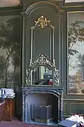 Fireplace in the parlour, flanked by Moucheron wall paintings