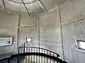 Interior view of Gibbs Hill Lighthouse showing the cast iron plates of the outer wall.