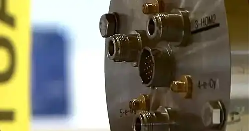 A flange of the cryomodule is used to connect instrumentation wires and cables.